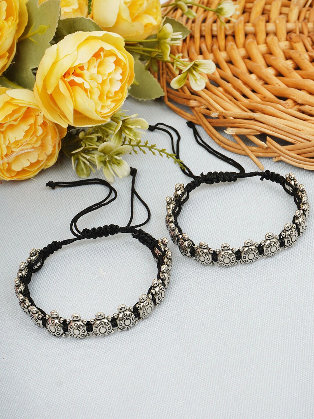 

Urmika Silver-Plated Turtle Thread Anklets