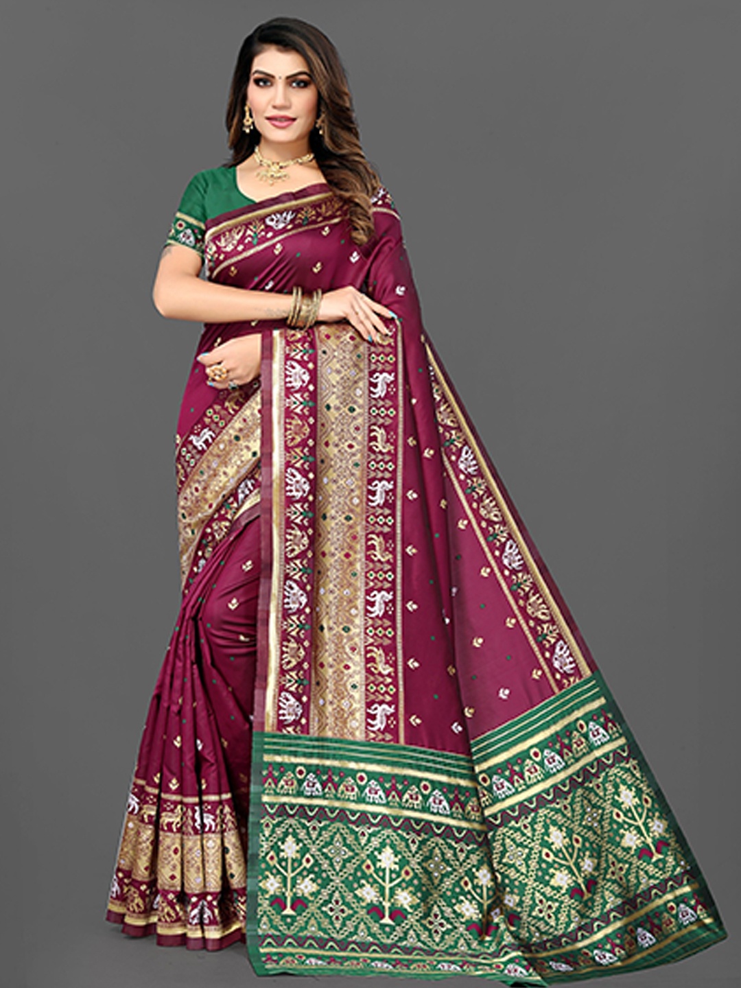 

Grubstaker Purple & Green Woven Design Zari Jute Silk Patola Saree
