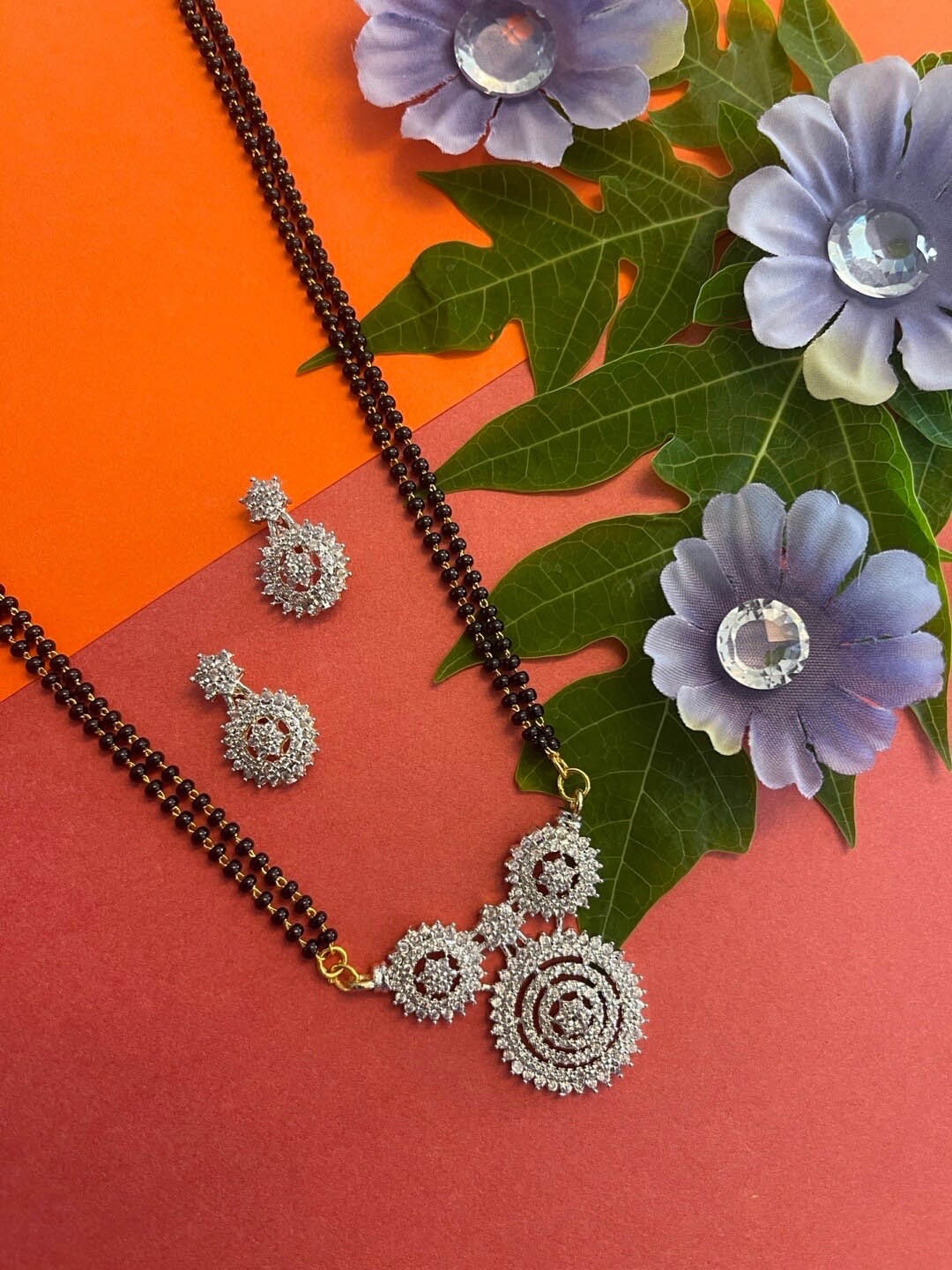 

Digital Dress Room AD Studded Round Pendant Beaded Chain Mangalsutra With Earrings, Black