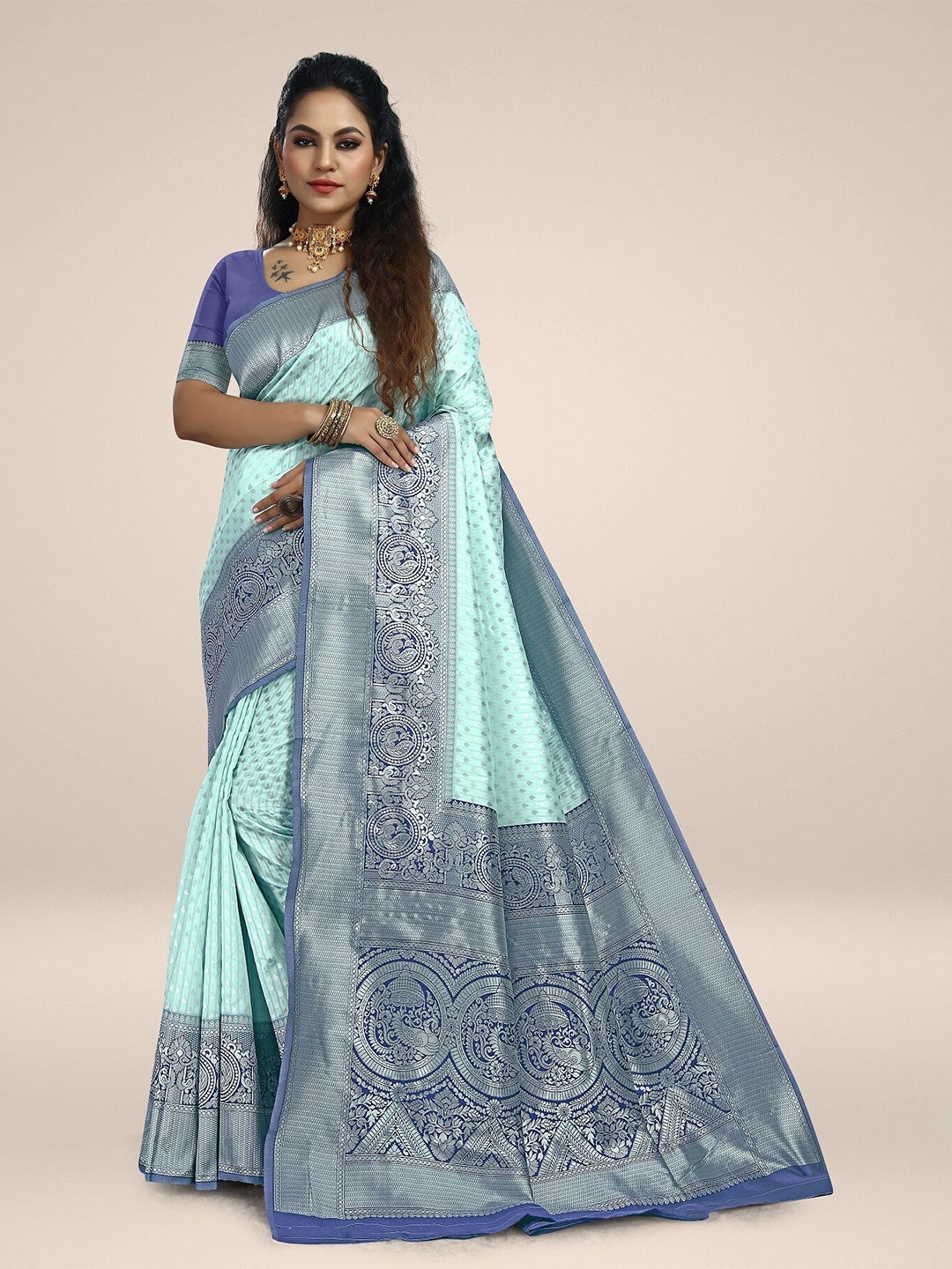 

Rivana Turquoise Blue & Green Woven Design Zari Silk Blend Kanjeevaram Saree