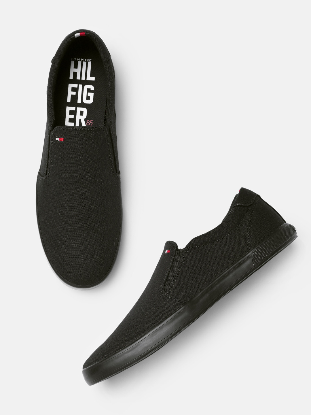 

Tommy Hilfiger Men Solid Regular Slip-On Sneakers, Black