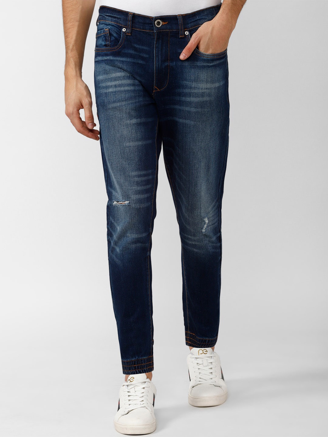 

Peter England Casuals Men Cotton Mildly Distressed Light Fade Jeans, Blue