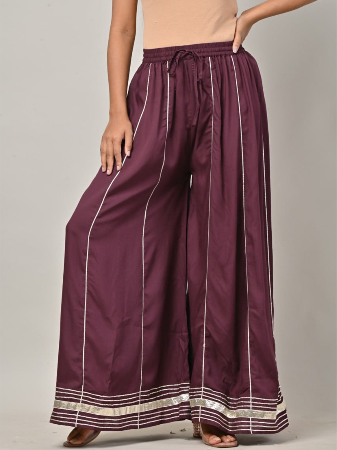 

Swasti Women Striped Flared Lace Palazzos, Purple