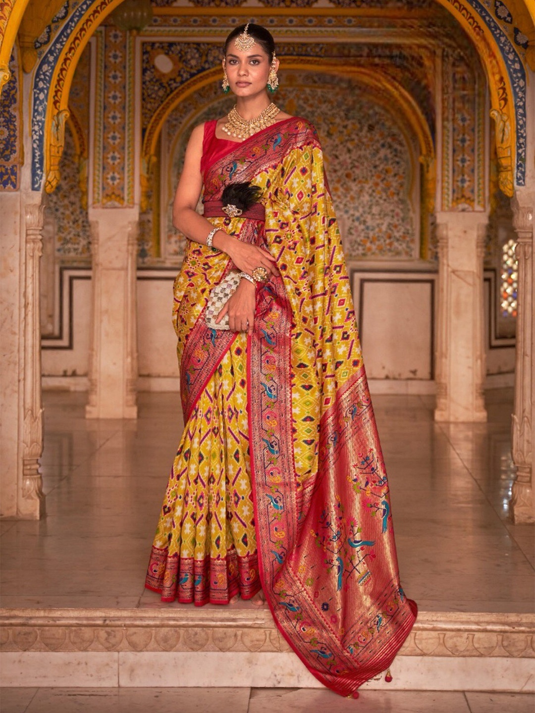 

Mitera Yellow & Pink Ethnic Motifs Zari Patola Saree