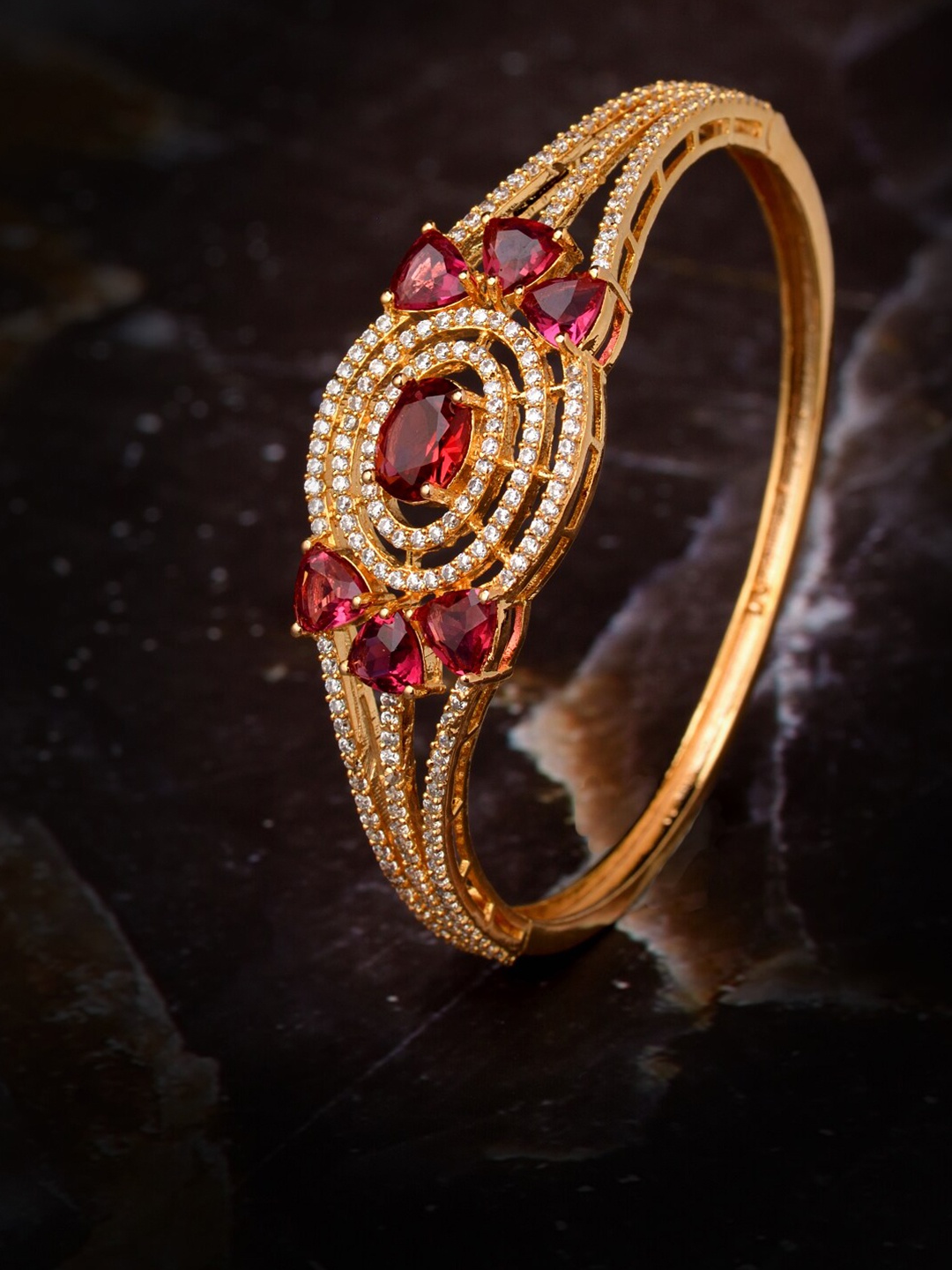 

Saraf RS Jewellery Women Gold-Toned & Red Brass Cubic Zirconia Handcrafted Gold-Plated Bangle-Style Bracelet