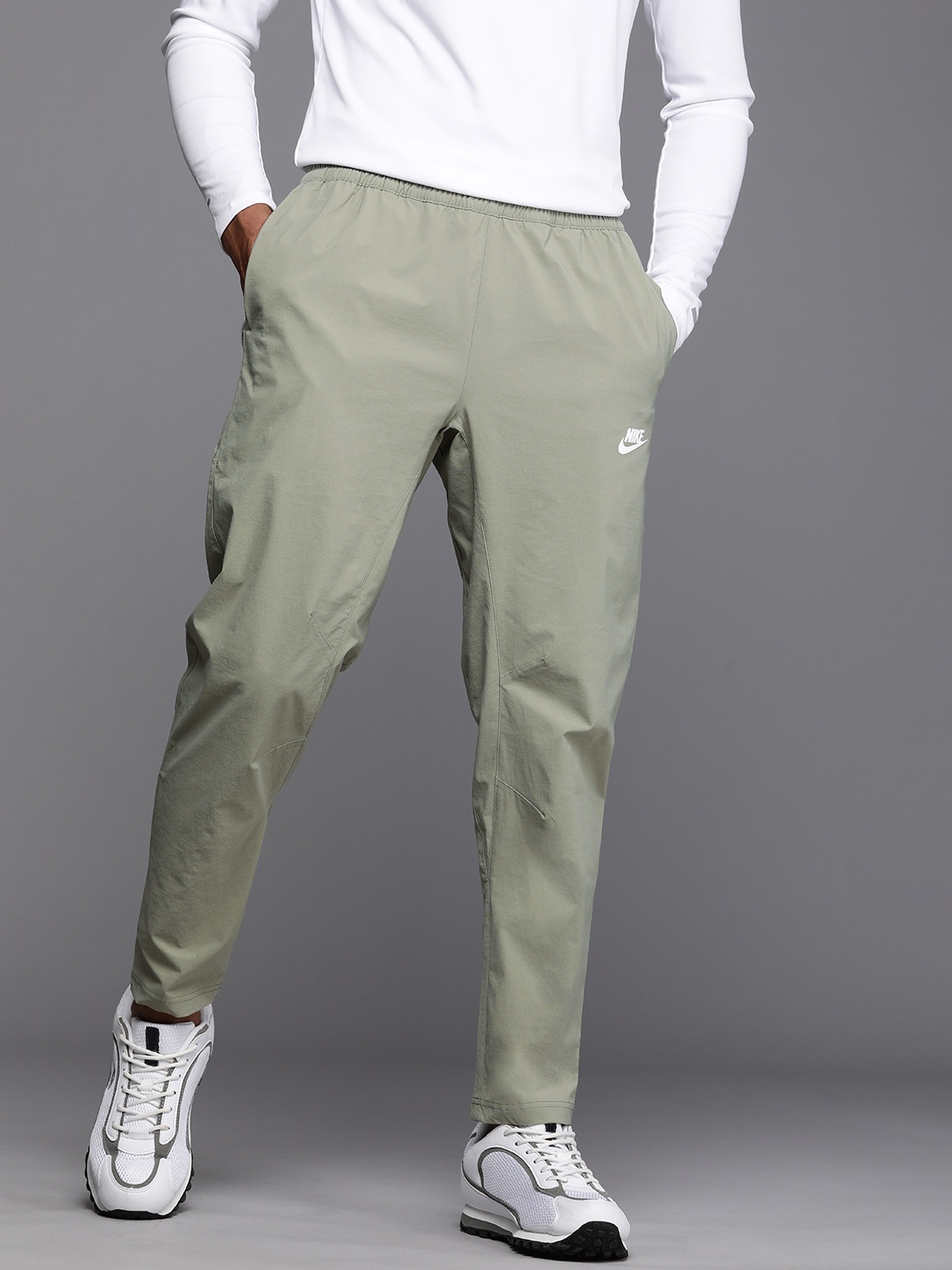 

Nike Men Sportswear Solid Regular Fit Track Pants, Green