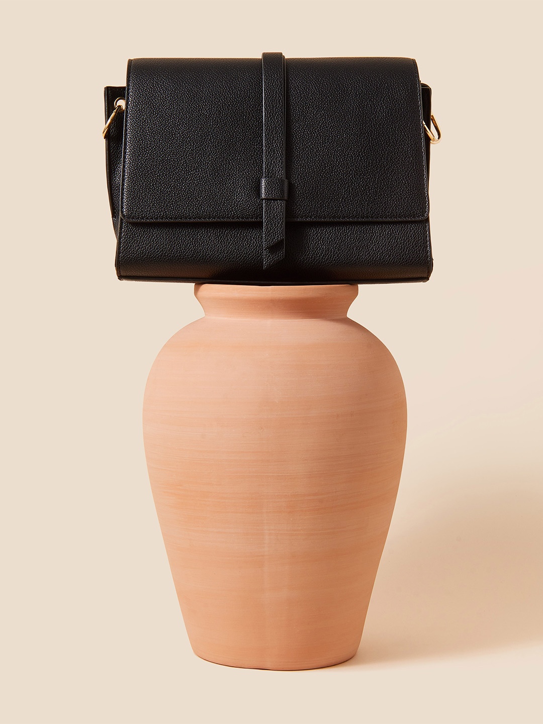 

Accessorize London Women Faux Leather Black Large Strap Detail Sling Bag