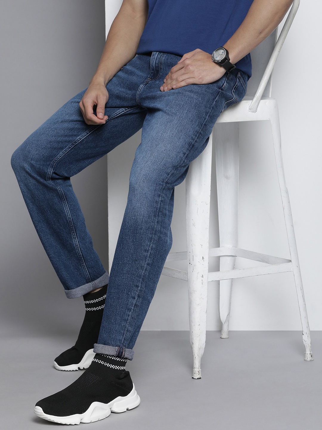 

Tommy Hilfiger Men Dad Tapered Fit Light Fade Stretchable Jeans, Blue