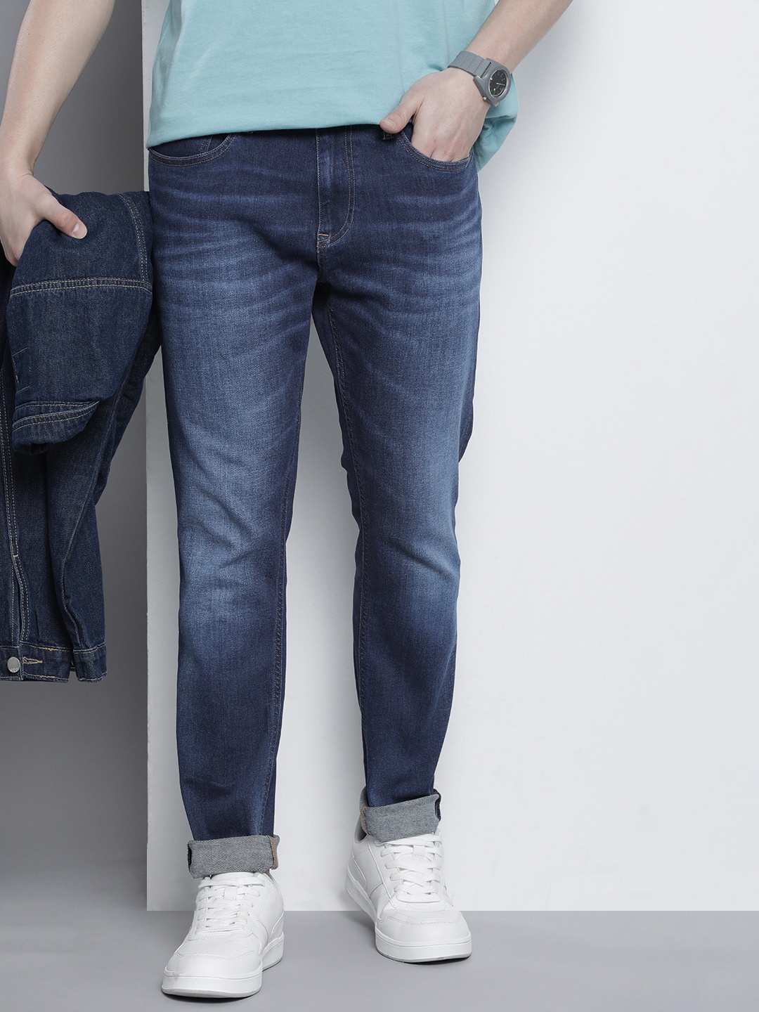 

Tommy Hilfiger Men Tapered Fit Heavy Fade Stretchable Jeans, Blue