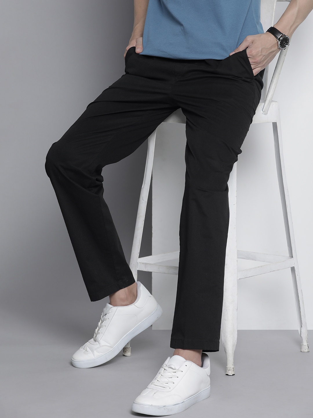 

Tommy Hilfiger Men Solid Mid-Rise Regular Trousers, Black
