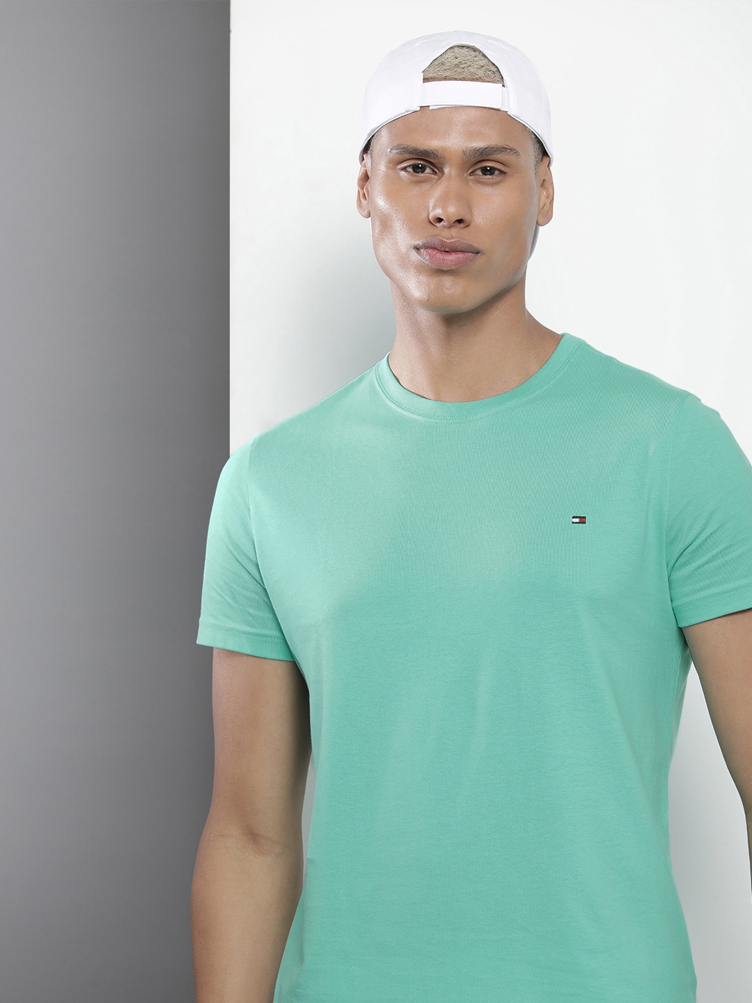 

Tommy Hilfiger Men Solid Pure Cotton Slim Fit T-shirt, Green