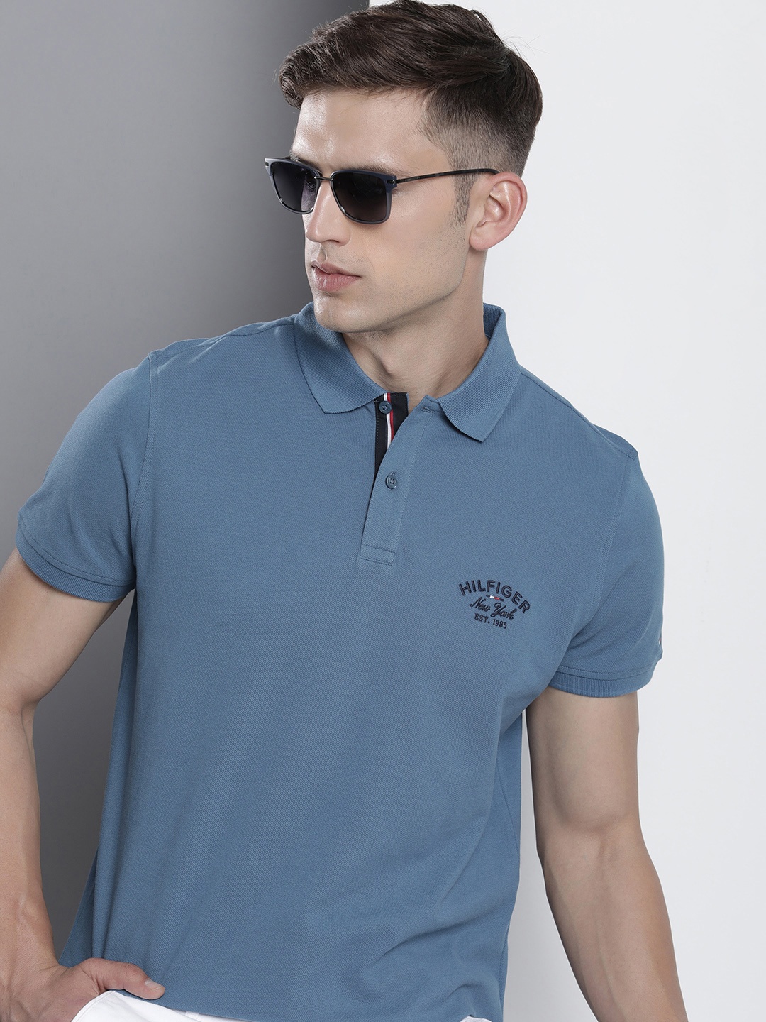 

Tommy Hilfiger Men Pure Cotton Solid Polo Collar T-shirt, Blue