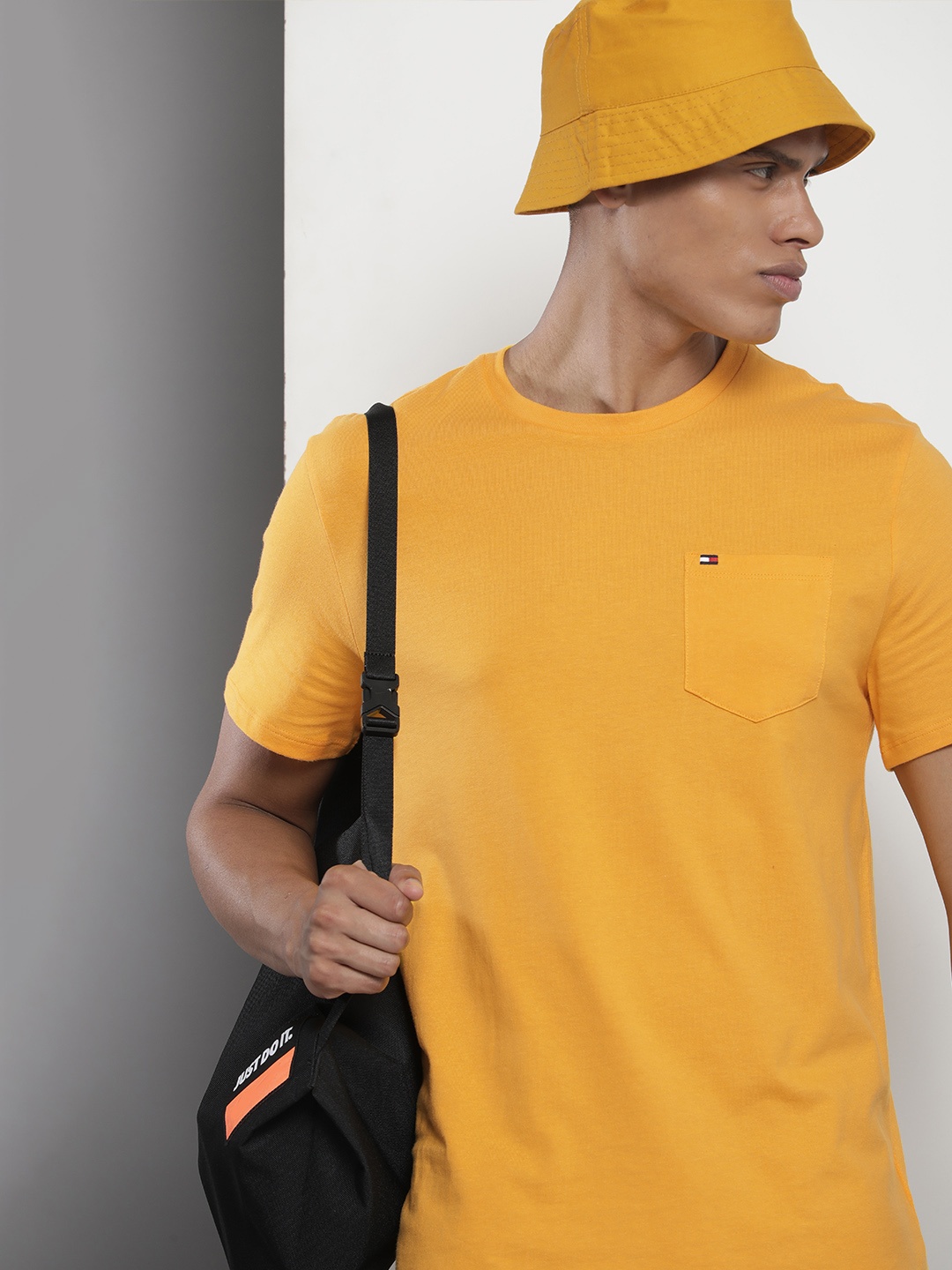 

Tommy Hilfiger Men Solid Pure Cotton T-shirt, Yellow