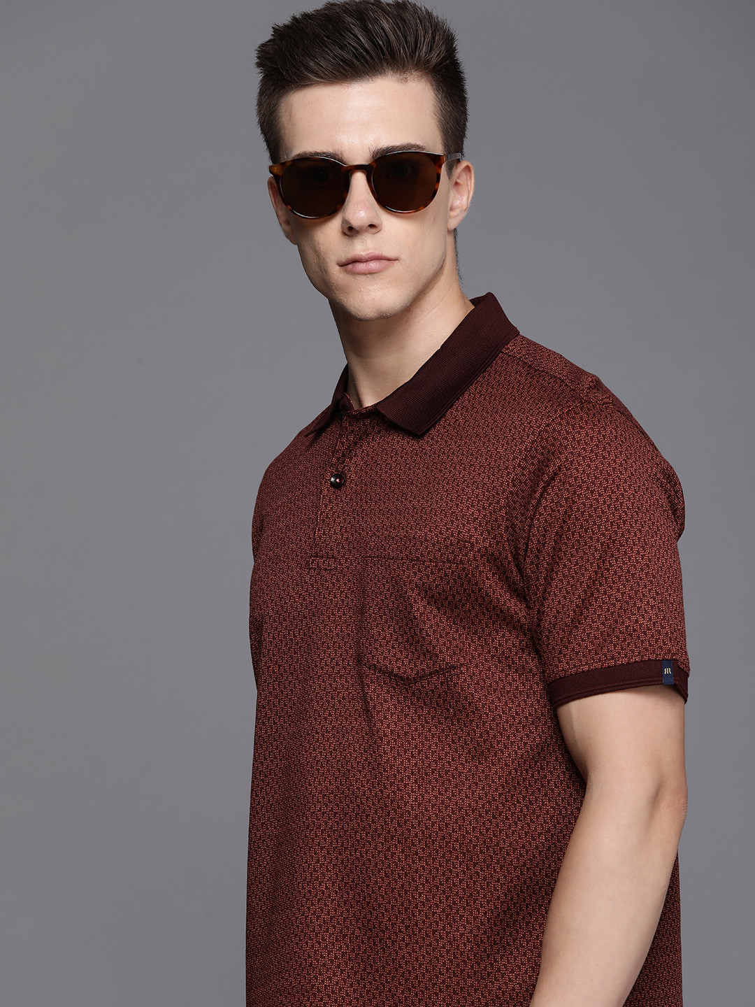 

Raymond Self Design Polo Collar Pure Cotton Pockets T-shirt, Maroon