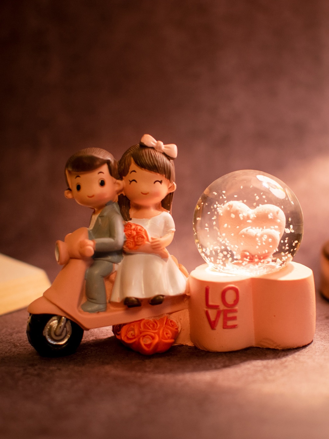 

StatueStudio Couple On Scooter With Hearts In LED Dome Valentine Gift Showpiece, Pink