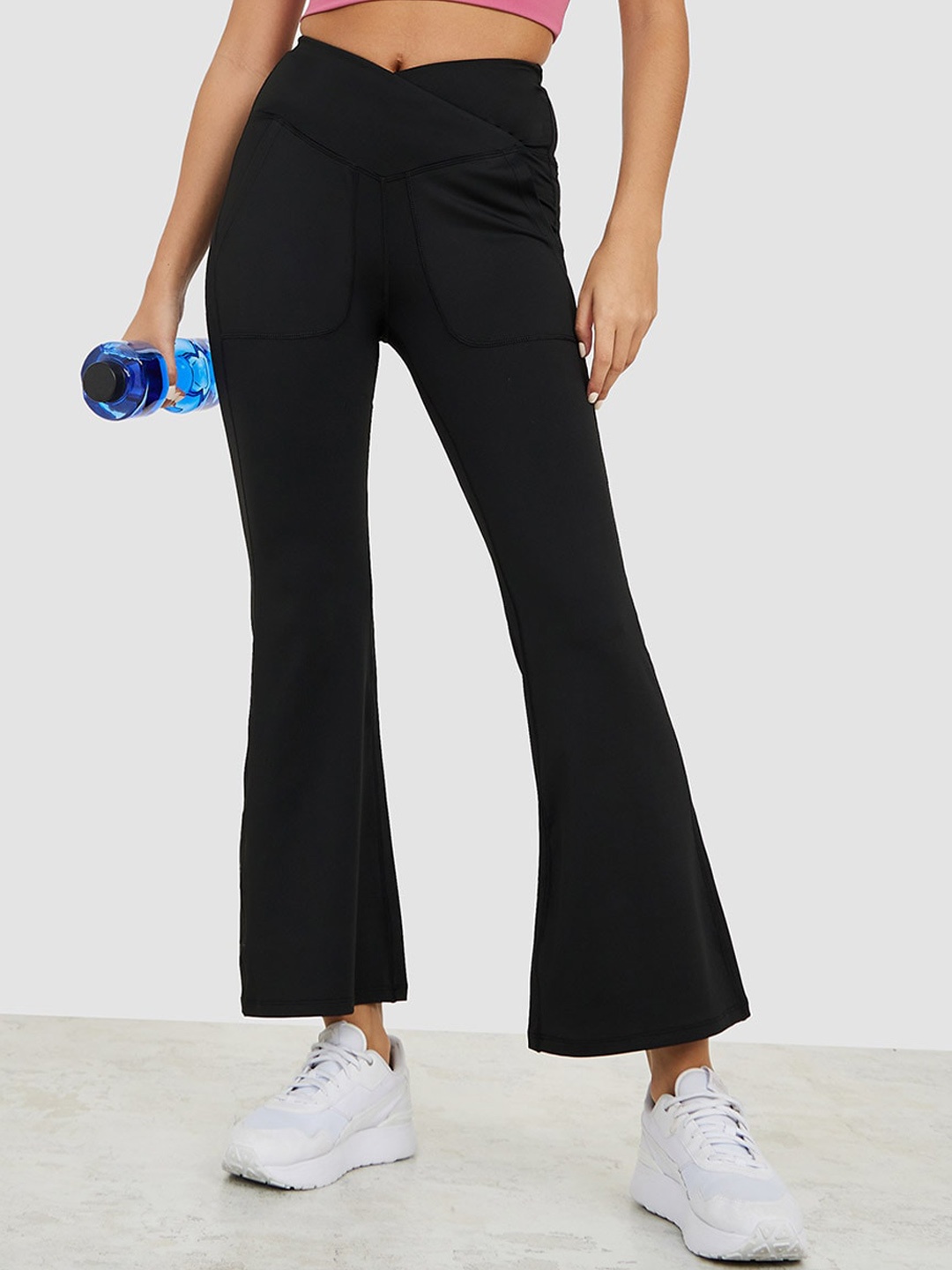 

Styli Women Solid Bootcut Mid-Rise Wrap Style Track Pants, Black