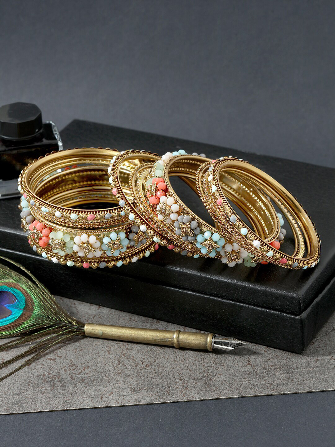 

AccessHer Set Of 18 Gold-Plated Stone Studded & Beaded Bangles