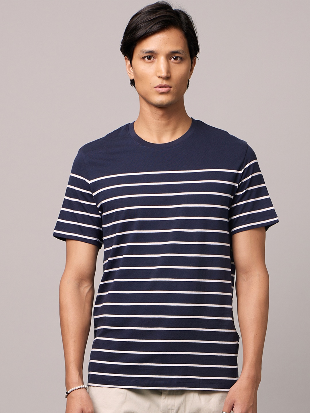 

Celio Men Navy Blue Striped Polo Collar T-shirt