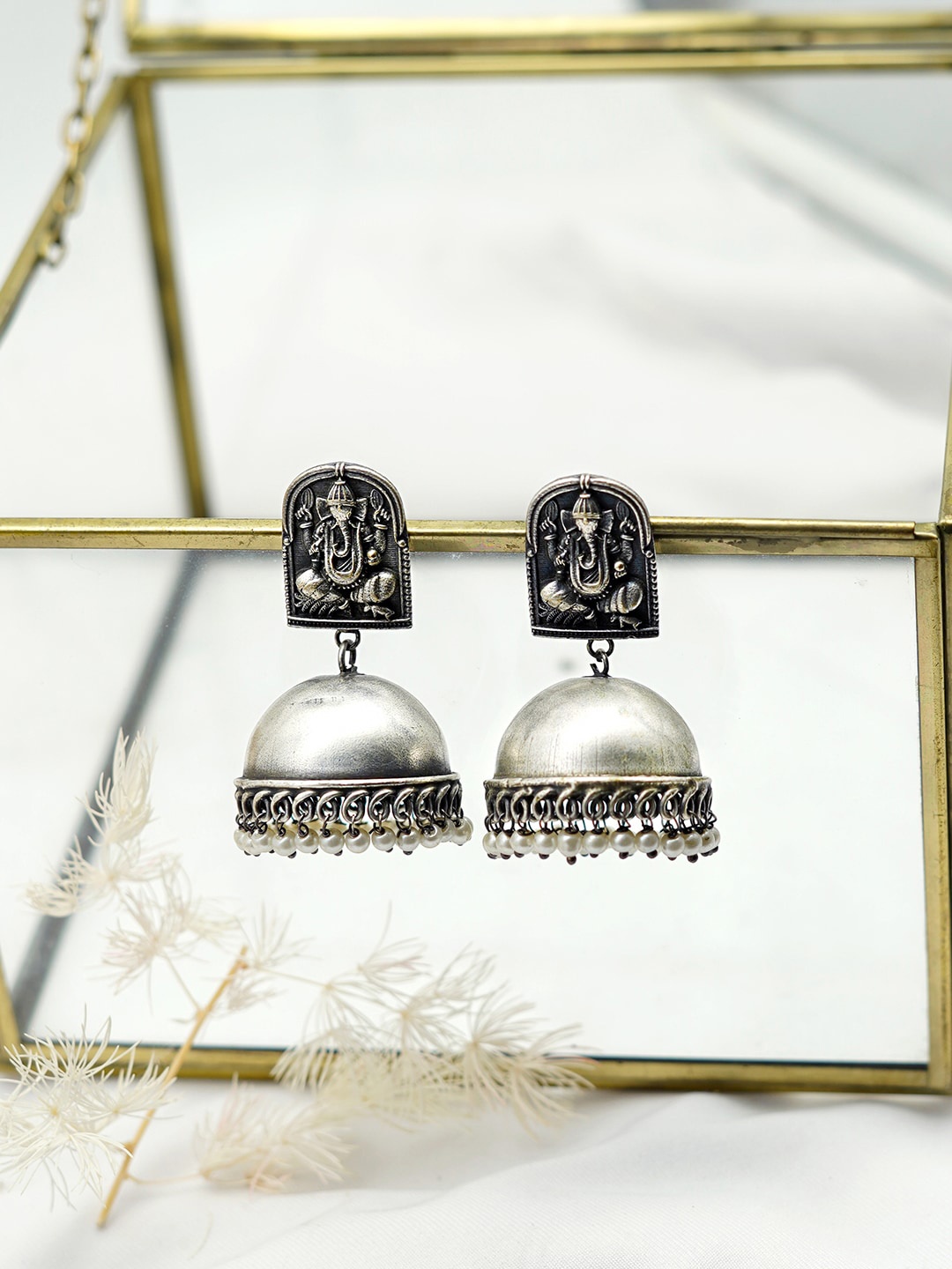 

TEEJH Silver-Plated Dome Shaped Oxidised Jhumkas Earrings