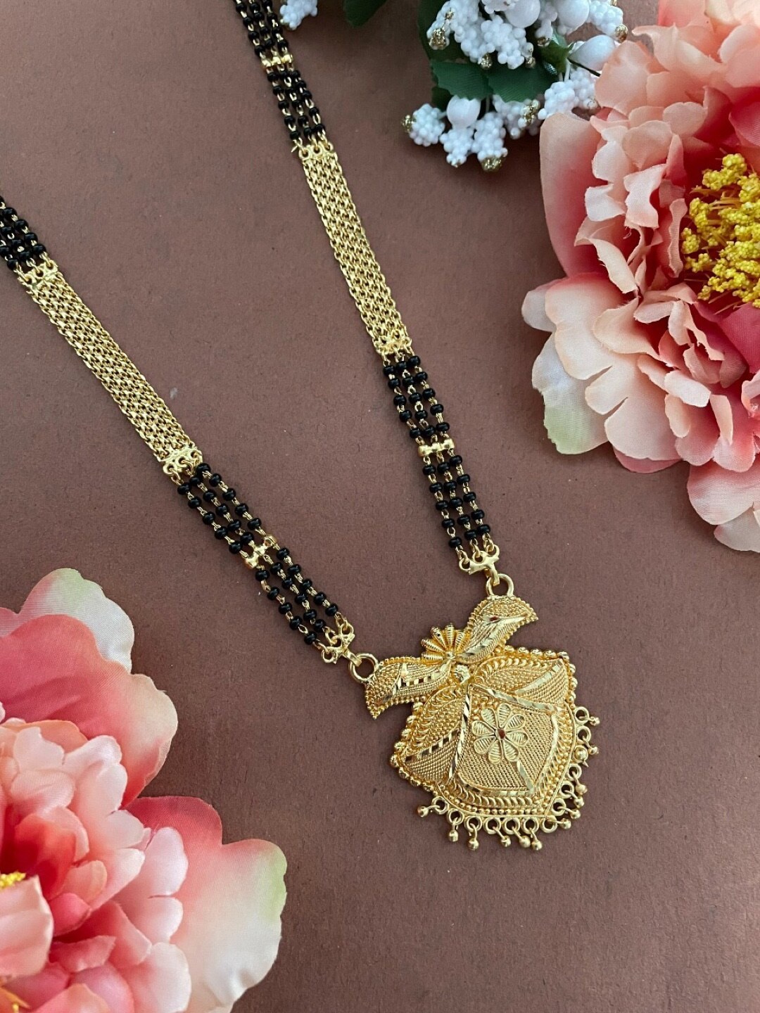 

Digital Dress Room Gold-Plated Stone-Studded & Beaded Mangalsutra