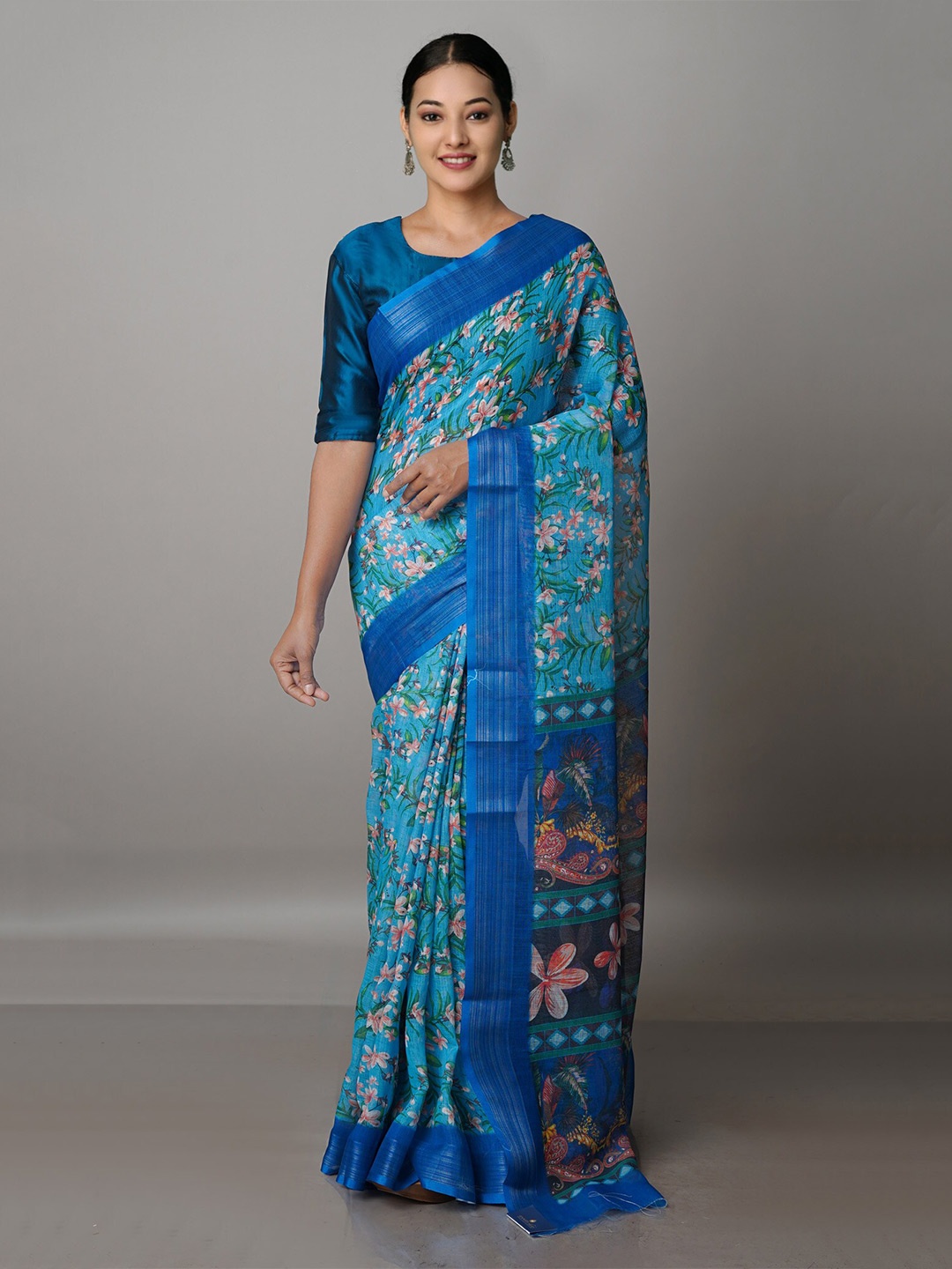 

Unnati Silks Blue & Orange Floral Zari Linen Blend Jamdani Saree