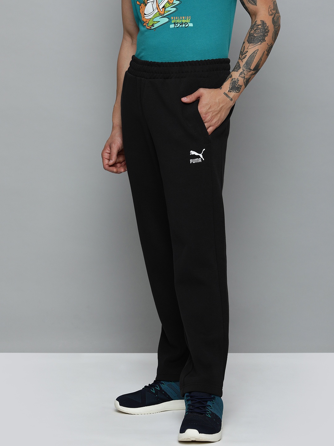 

Puma Men Solid Mid Rise T7 Track Regular Fit Sustainable Track Pants, Black