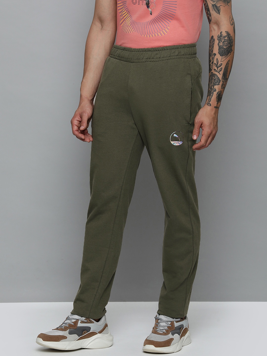 

one8 x PUMA Men Solid Mid Rise Knitted Slim Fit Track Pants, Olive