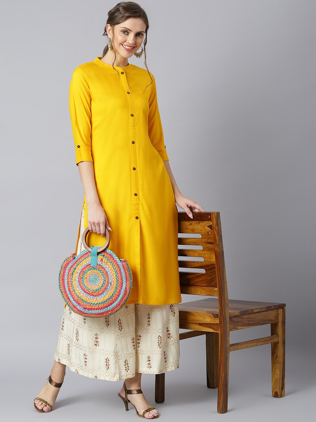 

Khushal K Women Band Collar Regular Kurta with Palazzos, Yellow