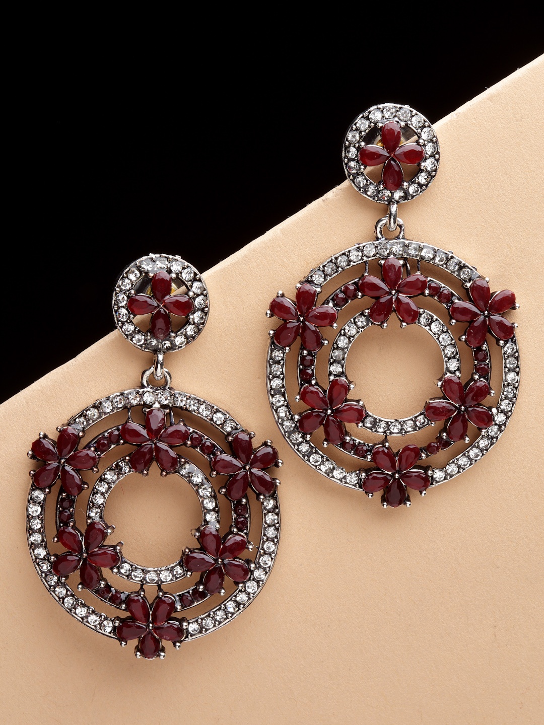 

PANASH Oxidised Silver-Plated Maroon & AD Stones Circular Shaped Drop Earrings