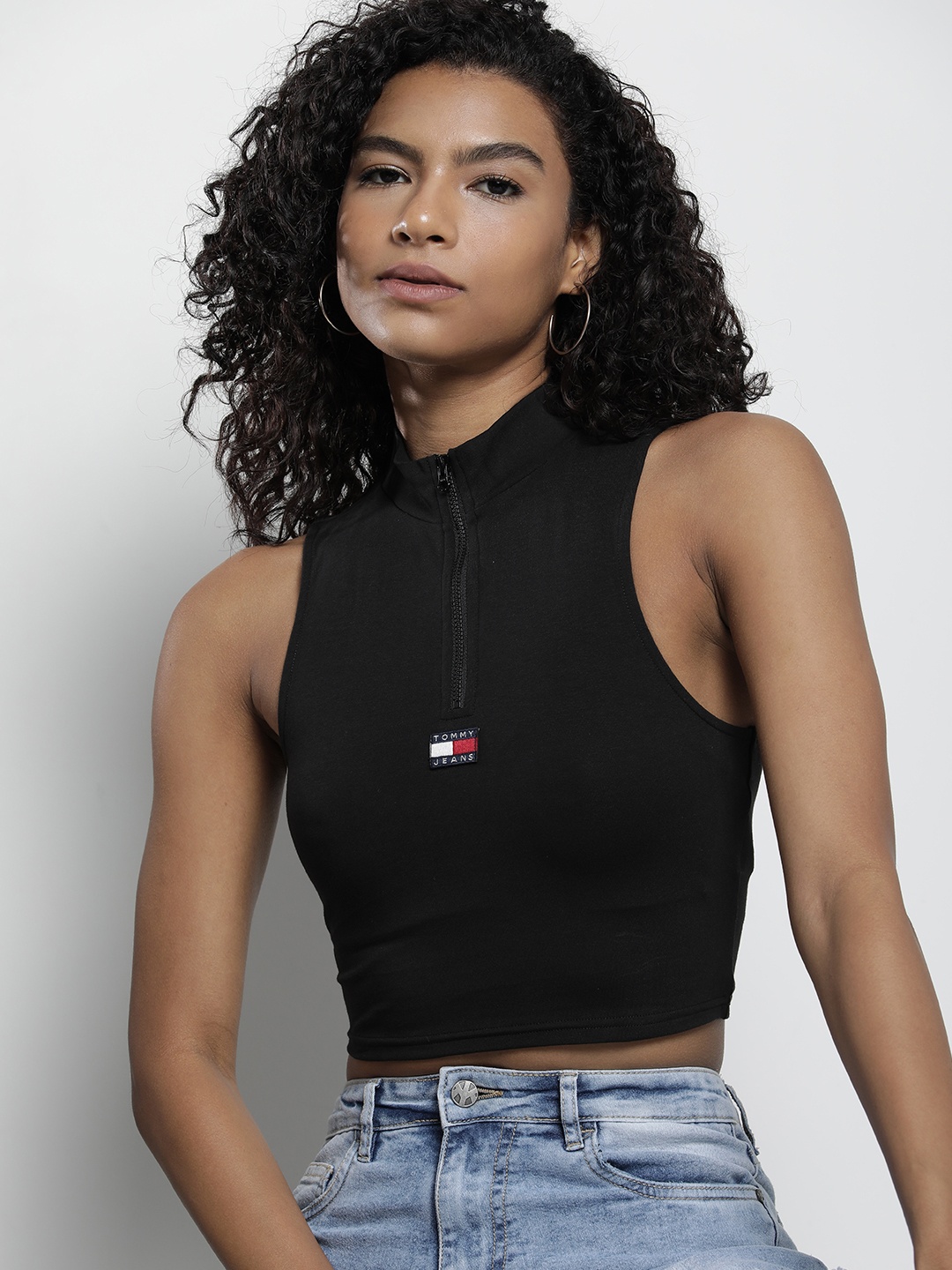 

Tommy Hilfiger Solid High Neck Sleeveless Fitted Crop Top With Applique Detail, Black