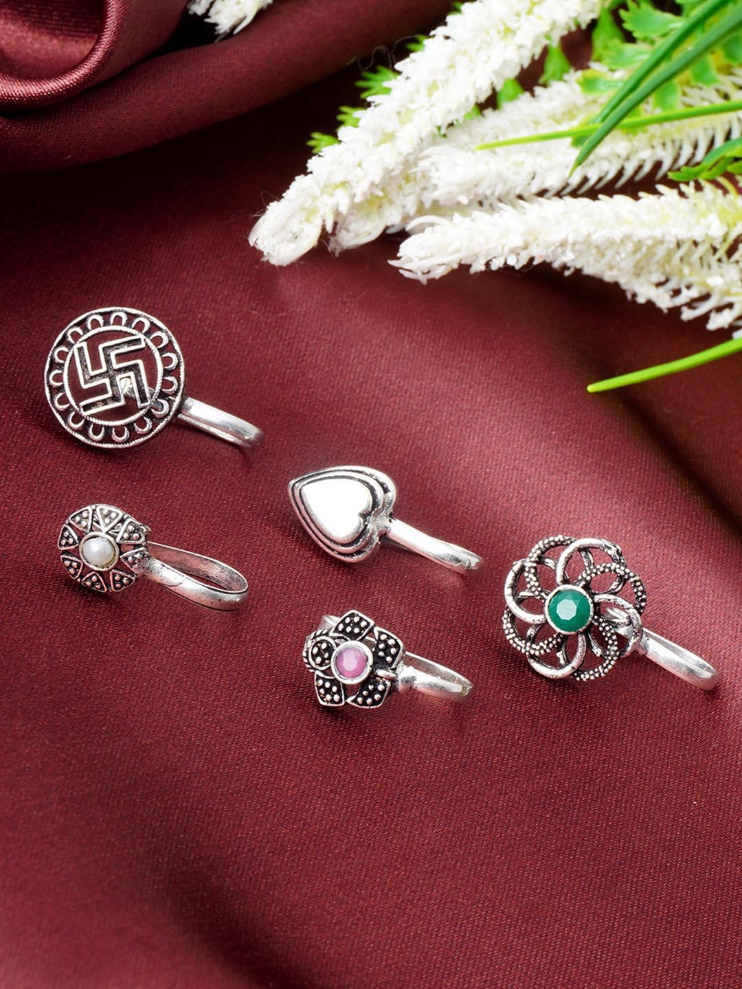 

Urmika Swastik Set Of 5 Oxidised Stone Studded Nosepin, Silver