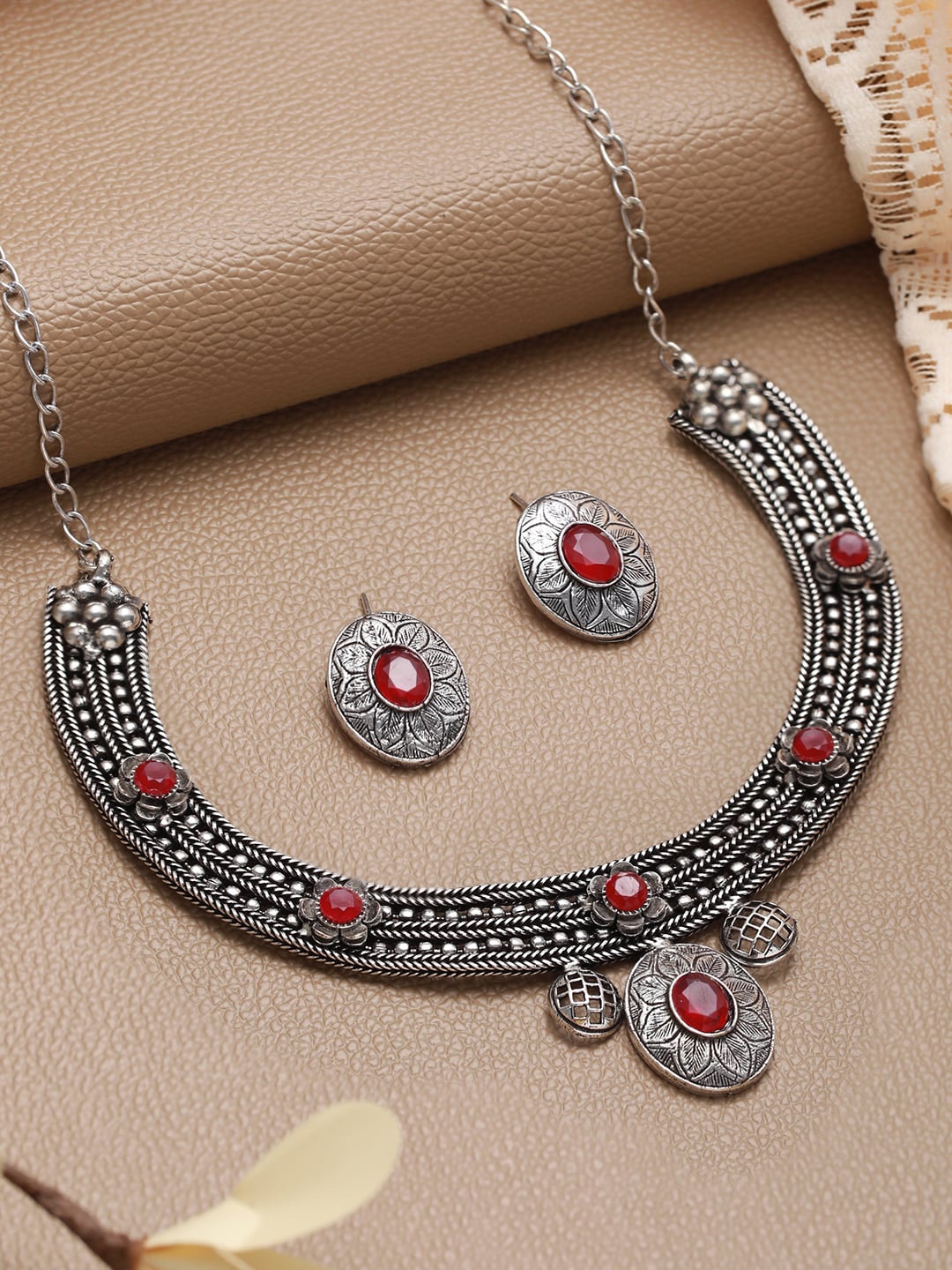 

Jazz and Sizzle Oxidised German Silver Stone Studded Jewellery Set