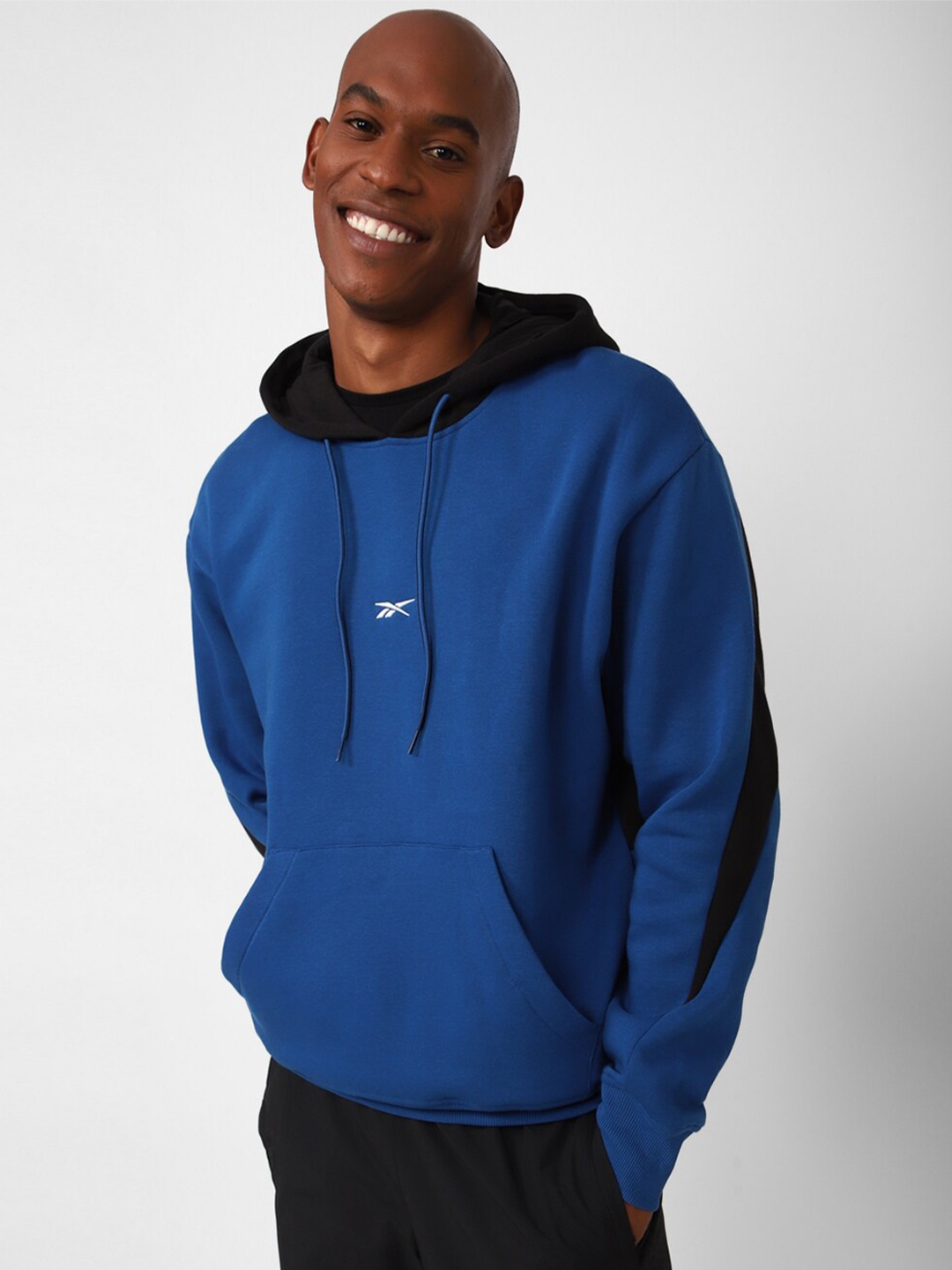 

Reebok Men Colourblocked Hooded Sweatshirt, Blue