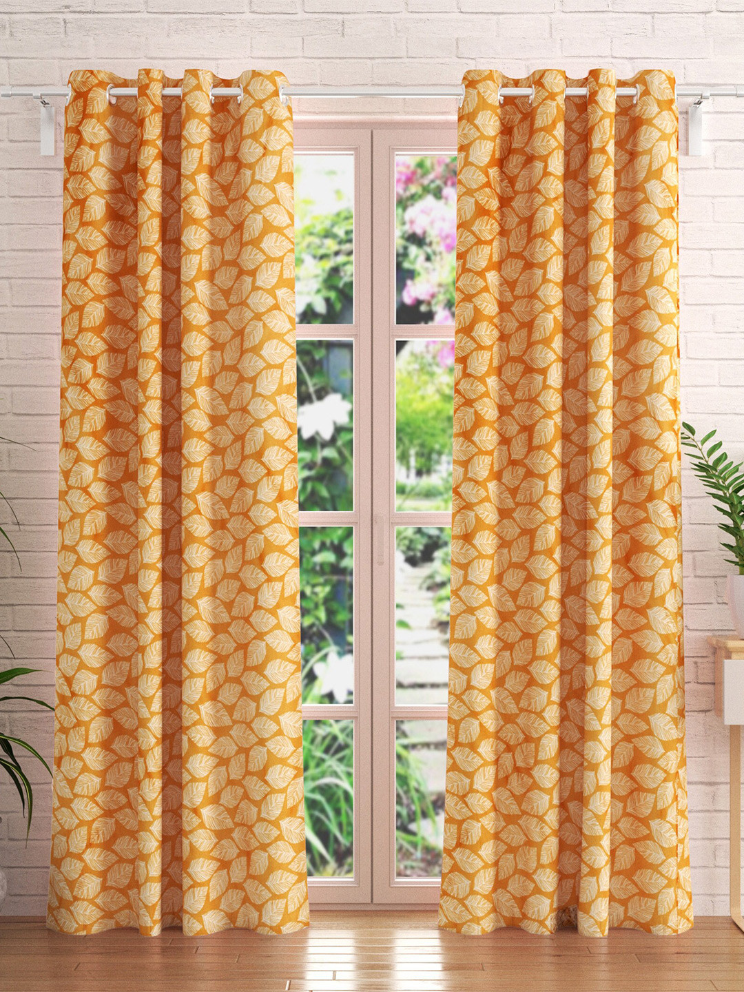 

Home Centre Essentials Vivian Set Of 2 Orange & White Printed Black Out Door Curtains