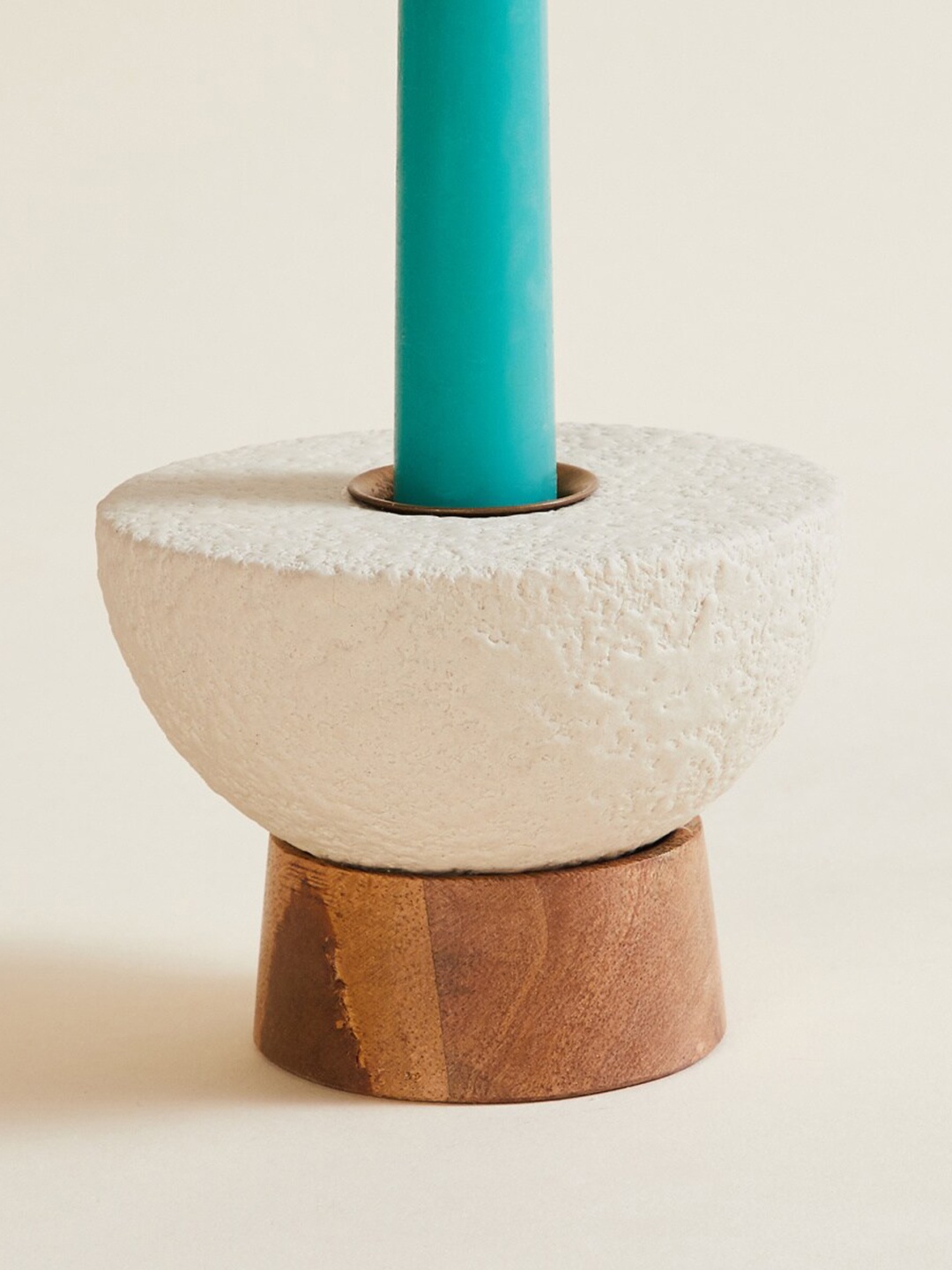 

Home Centre Beige Round Candle Holder With Wooden Base