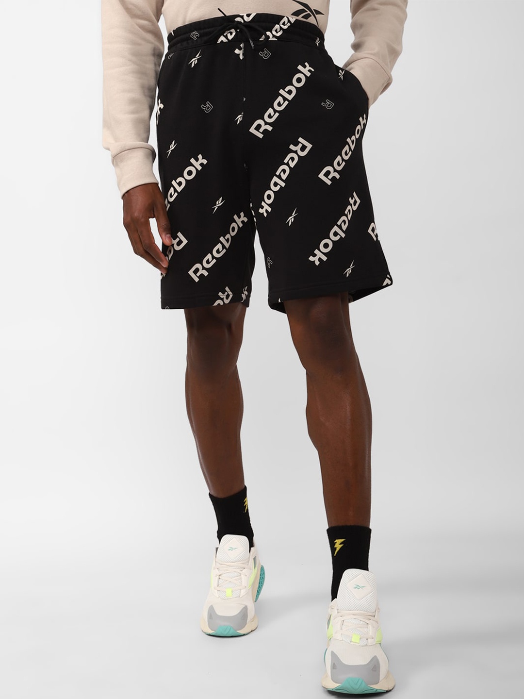 

Reebok Men Essentials RI AOP Typography Printed Slim Fit Cotton Shorts, Black