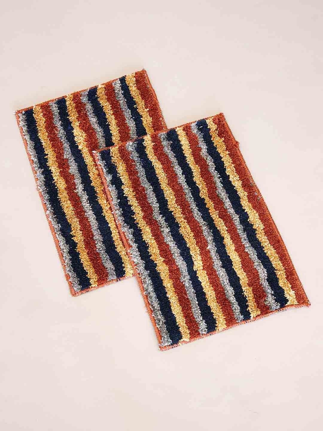 

Ariana 2 Pcs Grey & Orange-Colored Striped 1600 GSM Microfibre Anti-Skid Bath Rugs