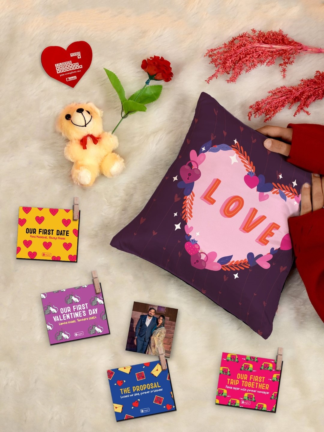 

Indigifts Valentines Love Gift Hamper 8 Pcs Cushion Teddy Greeting Card Rose & Photo Clips, Cream