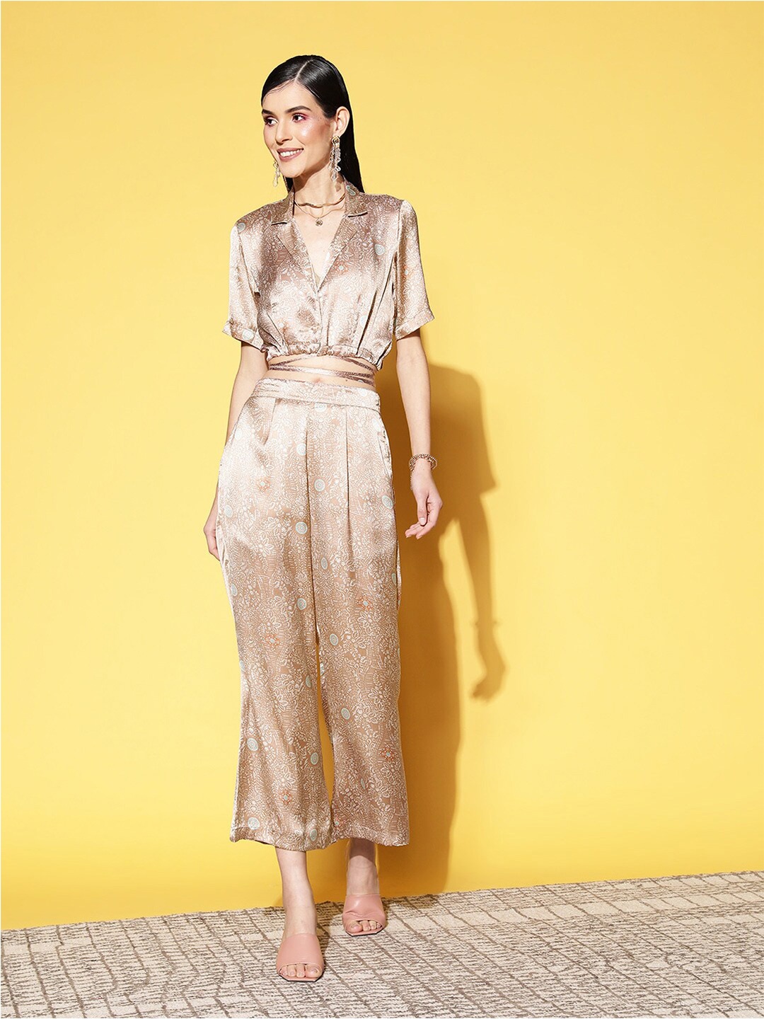 

ANVI Be Yourself Women Floral Printed Satin Straight Fit Palazzos, Beige