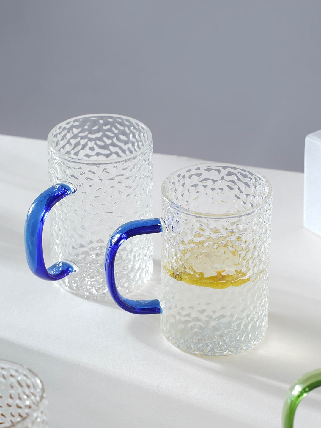 

Nestasia Transparent & Blue 2 Pcs Textured Transparent Glass Mugs 300 ml Each