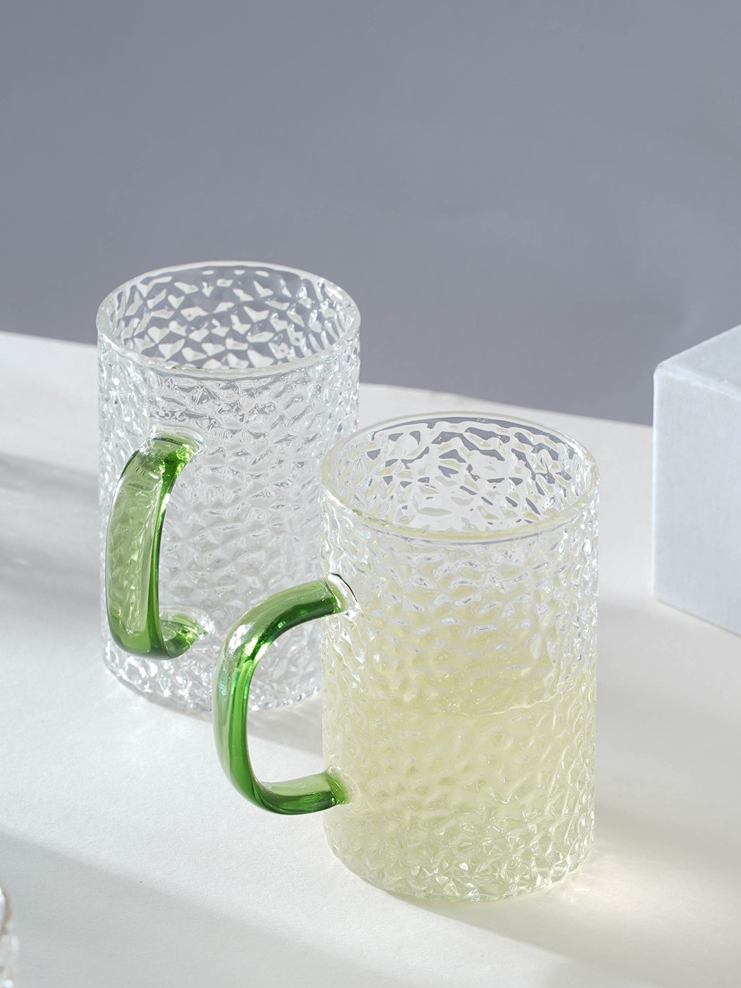 

Nestasia Transparent & Green 2 Pcs Textured Transparent Glass Mugs 300 ml Each