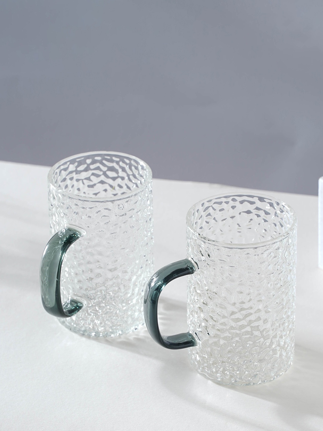 

Nestasia Transparent & Black 2 Pcs Textured Glossy Glass Mugs 300 ml Each