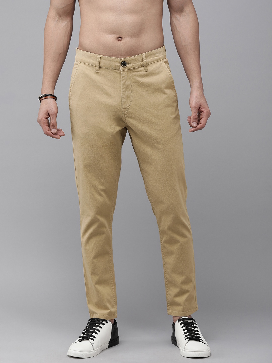 

The Roadster Lifestyle Co. Men Slim Fit Solid Mid-Rise Casual Trousers, Beige