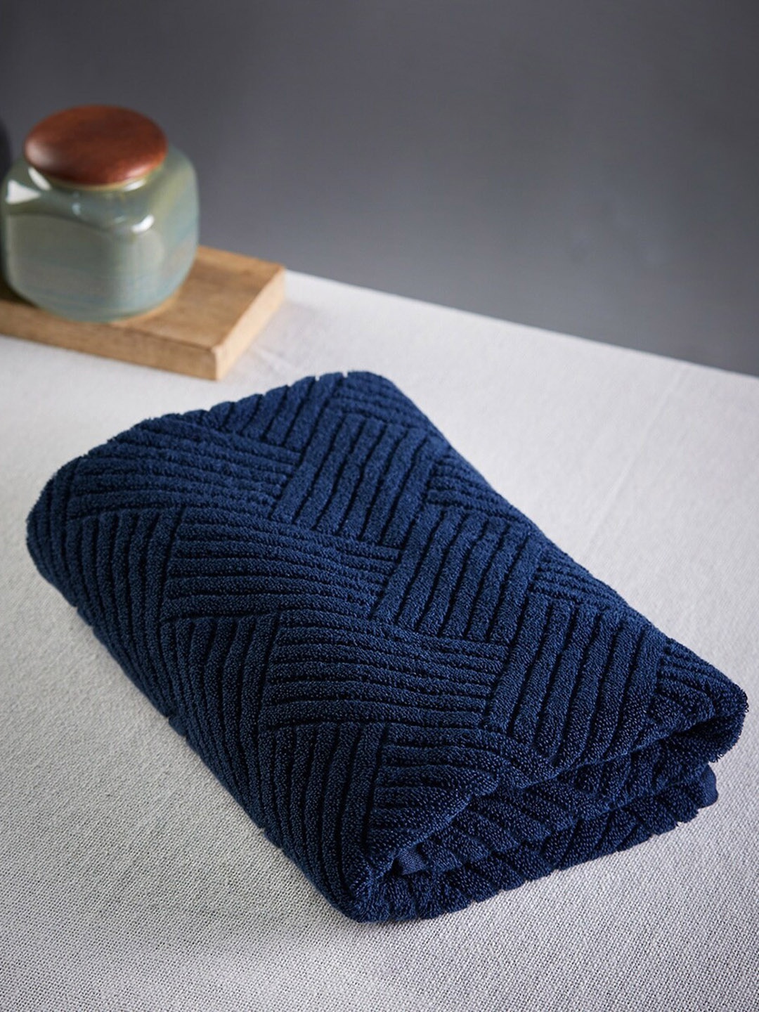 

Fabindia Palash 520 GSM Navy Blue Self-Design Cotton Hand Towel