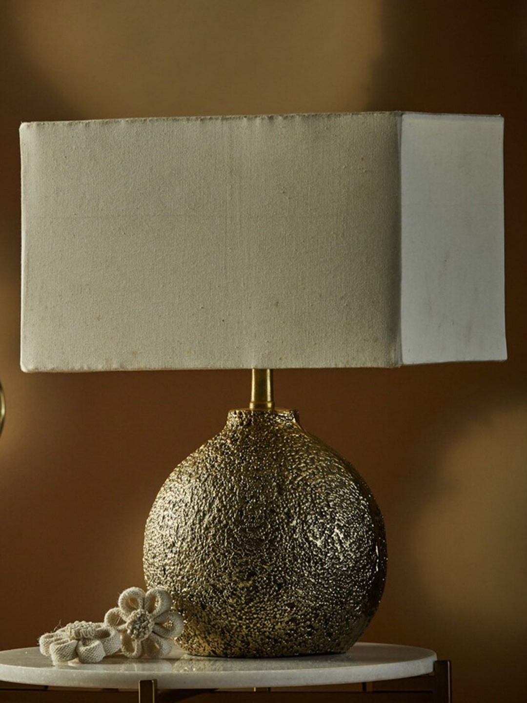 

Fabindia Shivesh Off White Textured Round-Shaped Table Lamp