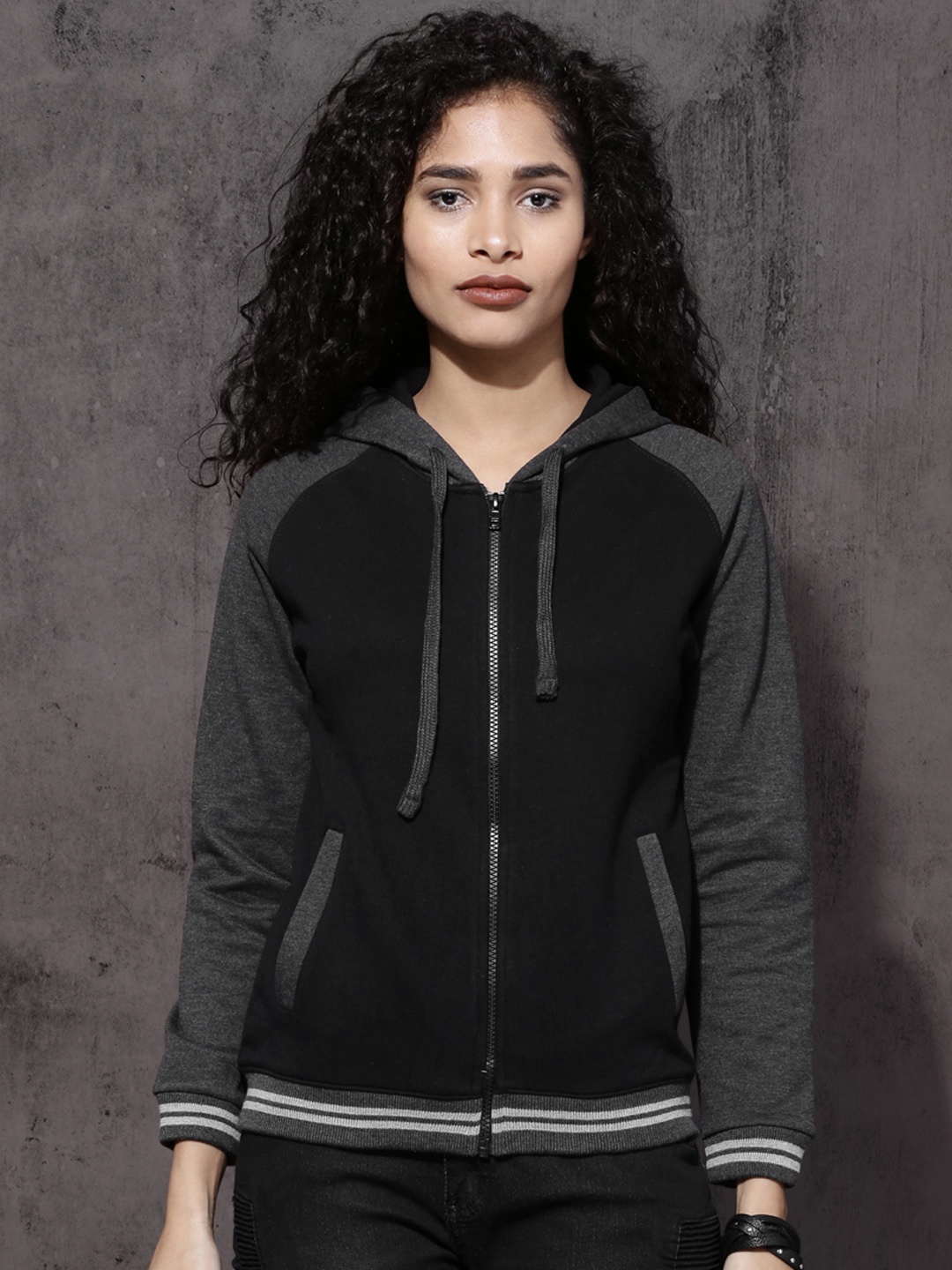 

Roadster Women Black Solid Hooded Sweatshirt