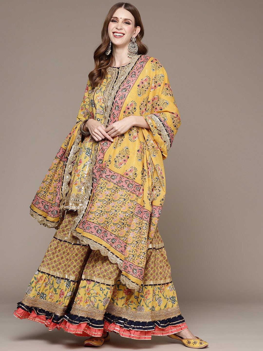 

Ishin Women Floral Printed Mirror Work Kurta with Sharara & With Dupatta, Yellow