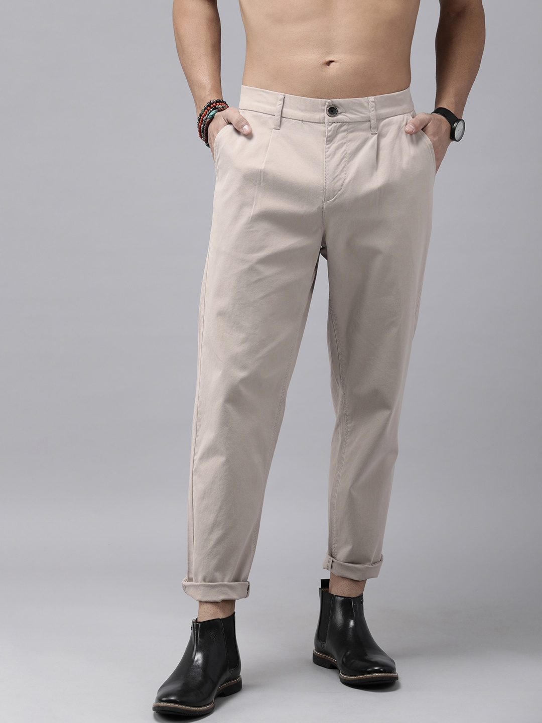 

The Roadster Lifestyle Co. Men Solid Relaxed Fit Pleated Chinos Trousers, Cream