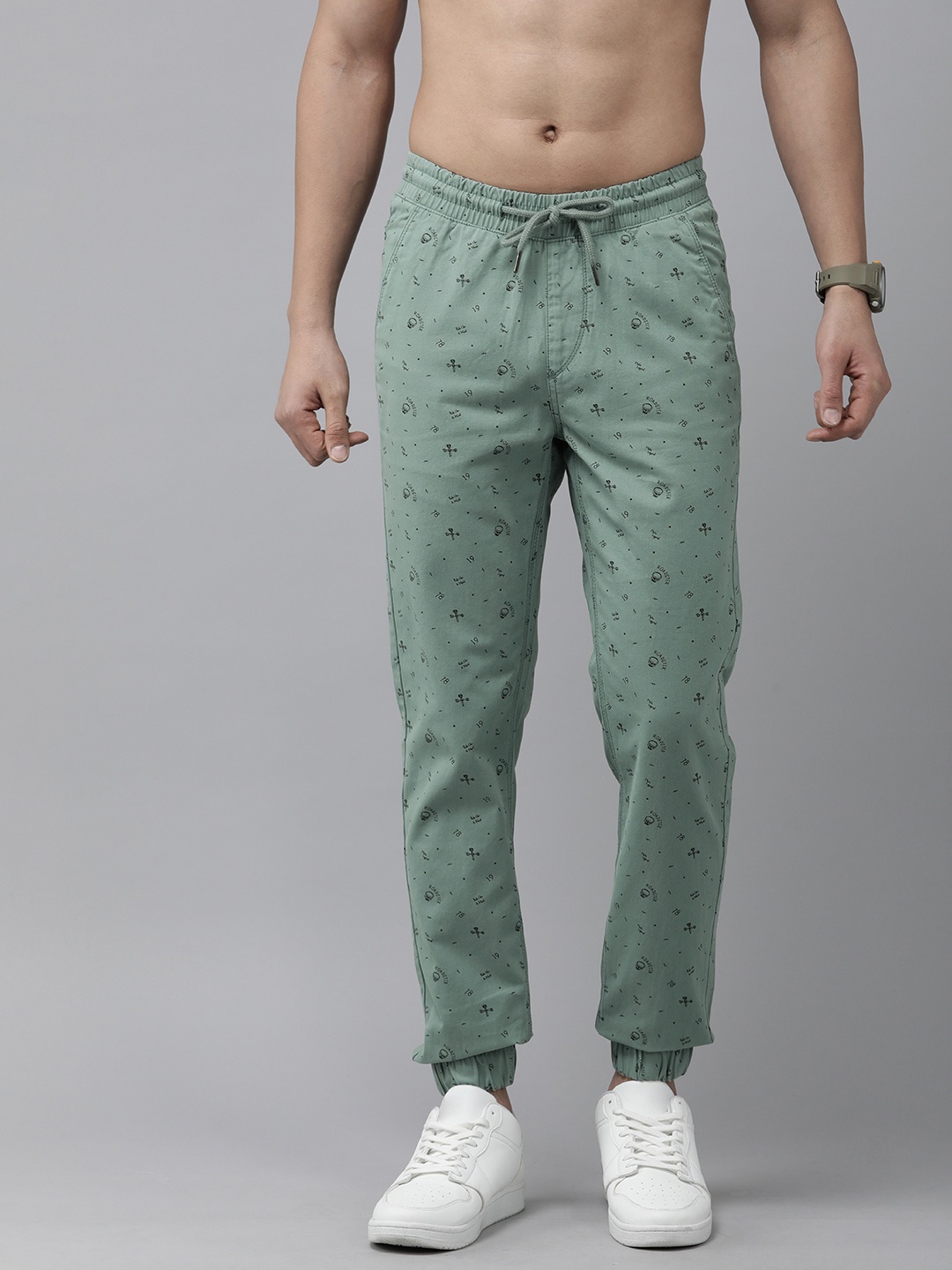 

The Roadster Lifestyle Co. Men Pure Cotton Typography Printed Pleated Joggers Trousers, Sea green