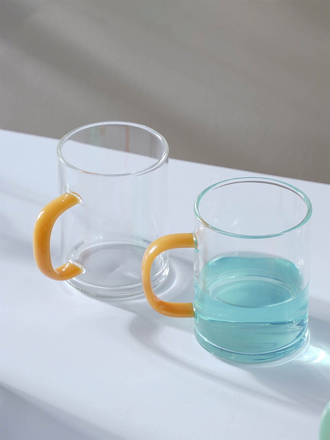 

Nestasia Transparent & Yellow 2 Pcs Solid Glass Mugs 220 ml Each